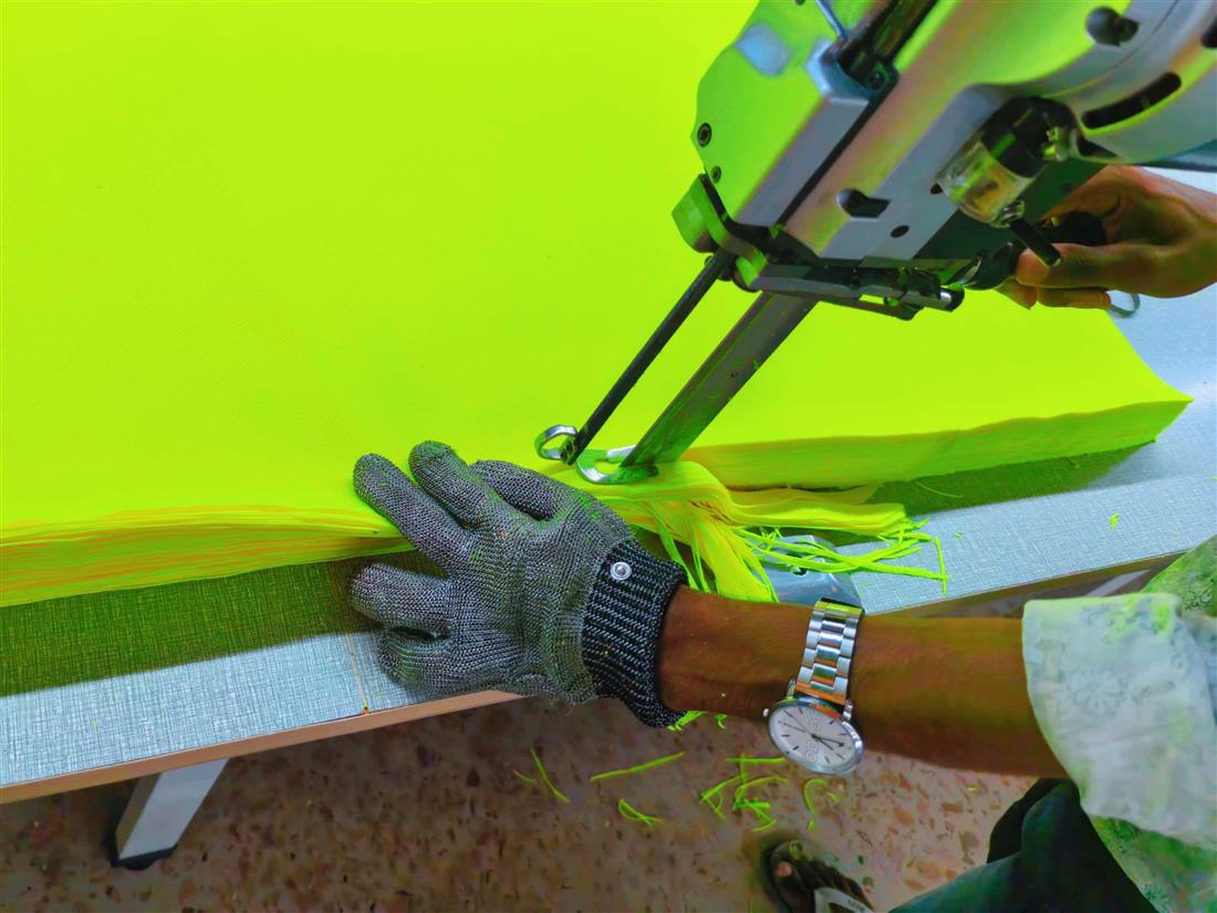 High visibility fabric being cut in stacks
