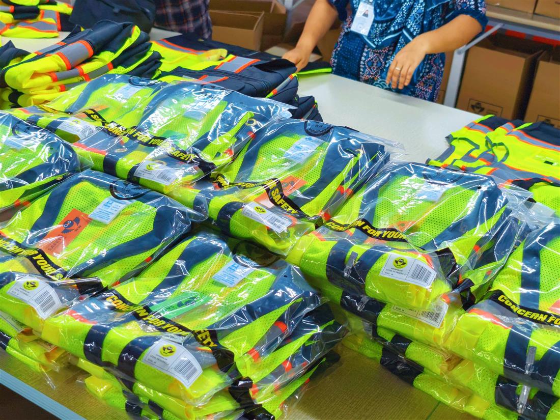 Packaged reflective garments prepared on a table